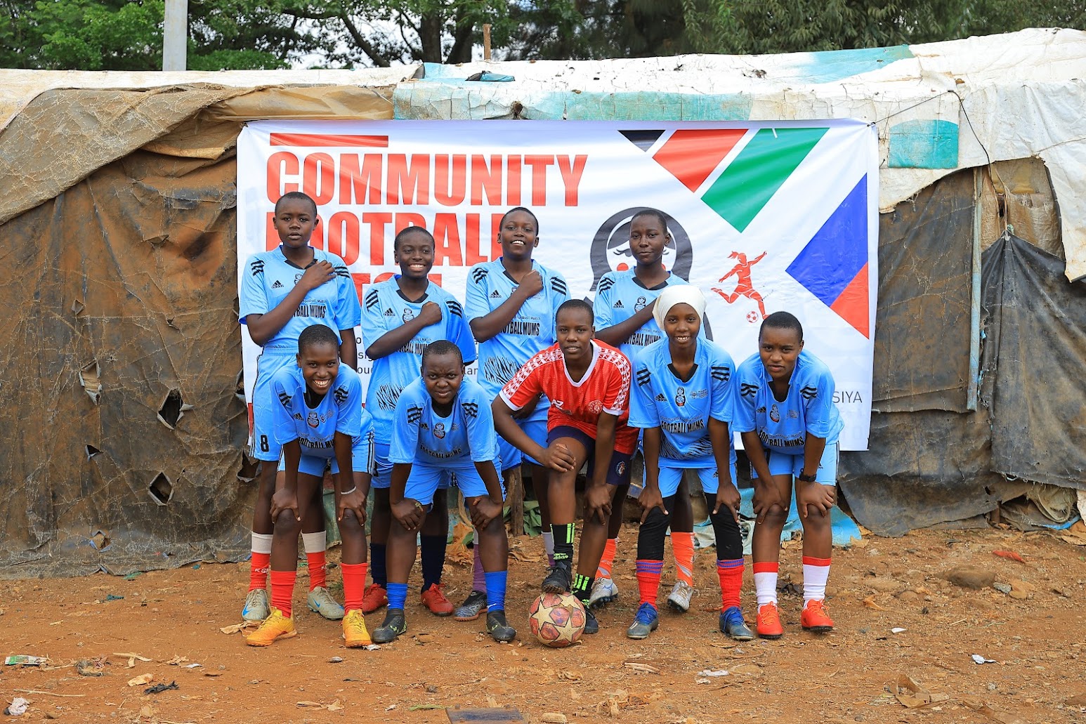 Young women and mothers competing at the Football Mums tournament
