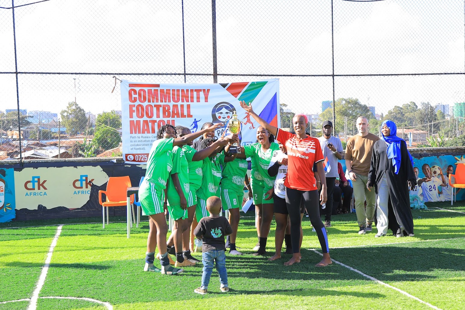 Players and families celebrating at the end of Edition 2