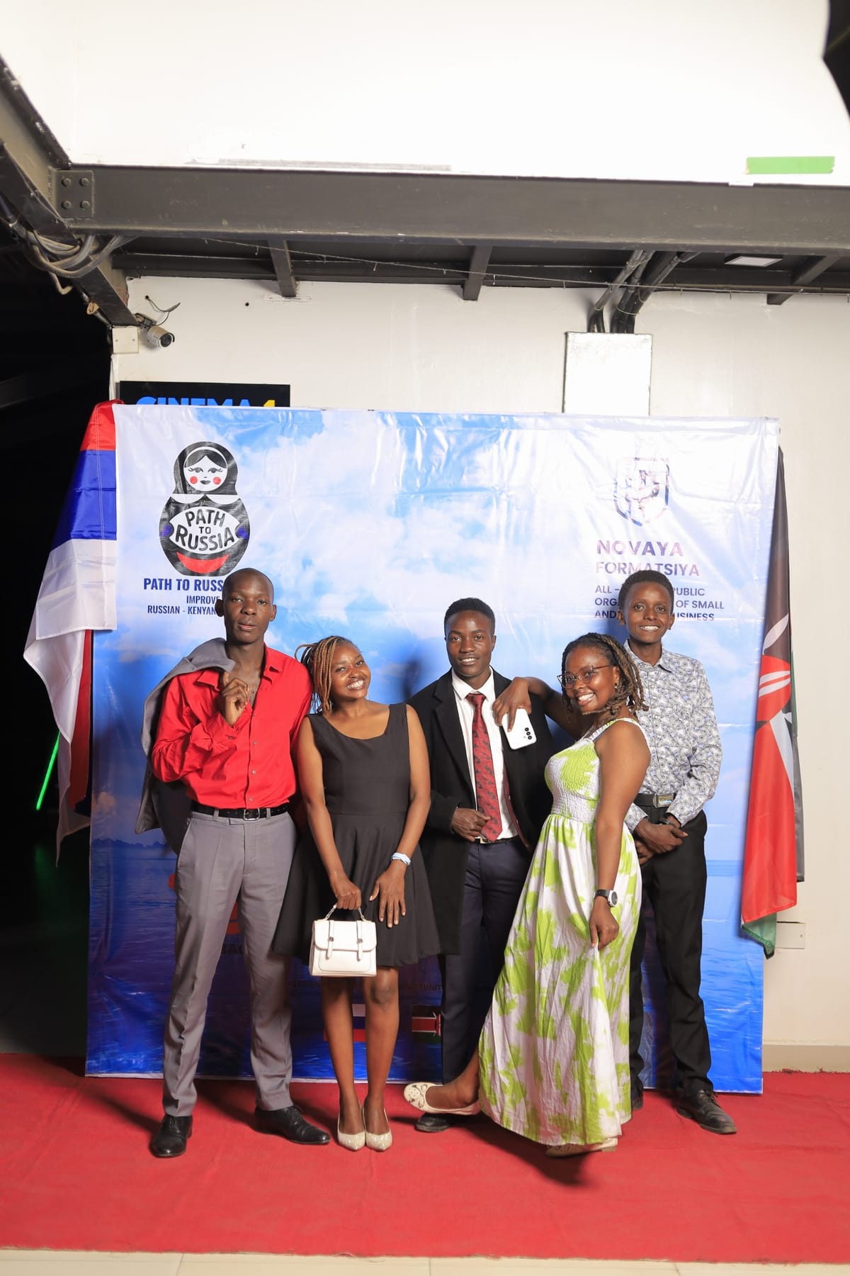 Guests photographed between the Russian and Kenyan flags